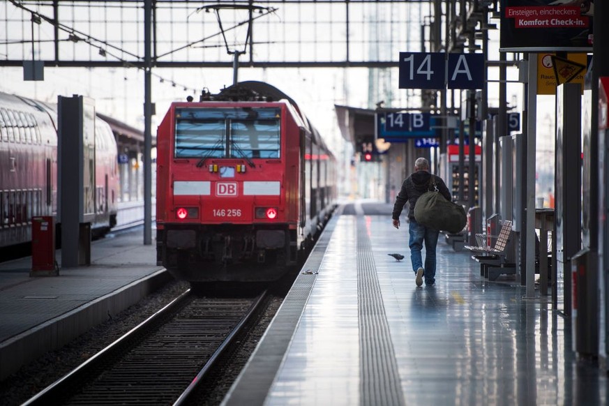 FRANKFURT, GERMANY - DECEMBER 10: A passenger walks to a regional train after a strike by Deutsche Bahn workers at central station on December 10, 2018 in Frankfurt/Main, Germany. The strike, launched ...