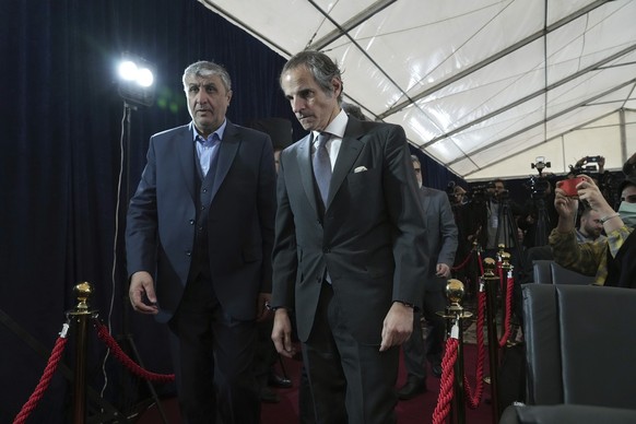 International Atomic Energy Organization, IAEA, Director General Rafael Mariano Grossi, right, and head of Atomic Energy Organization of Iran Mohammad Eslami arrive for a joint press conference in Teh ...