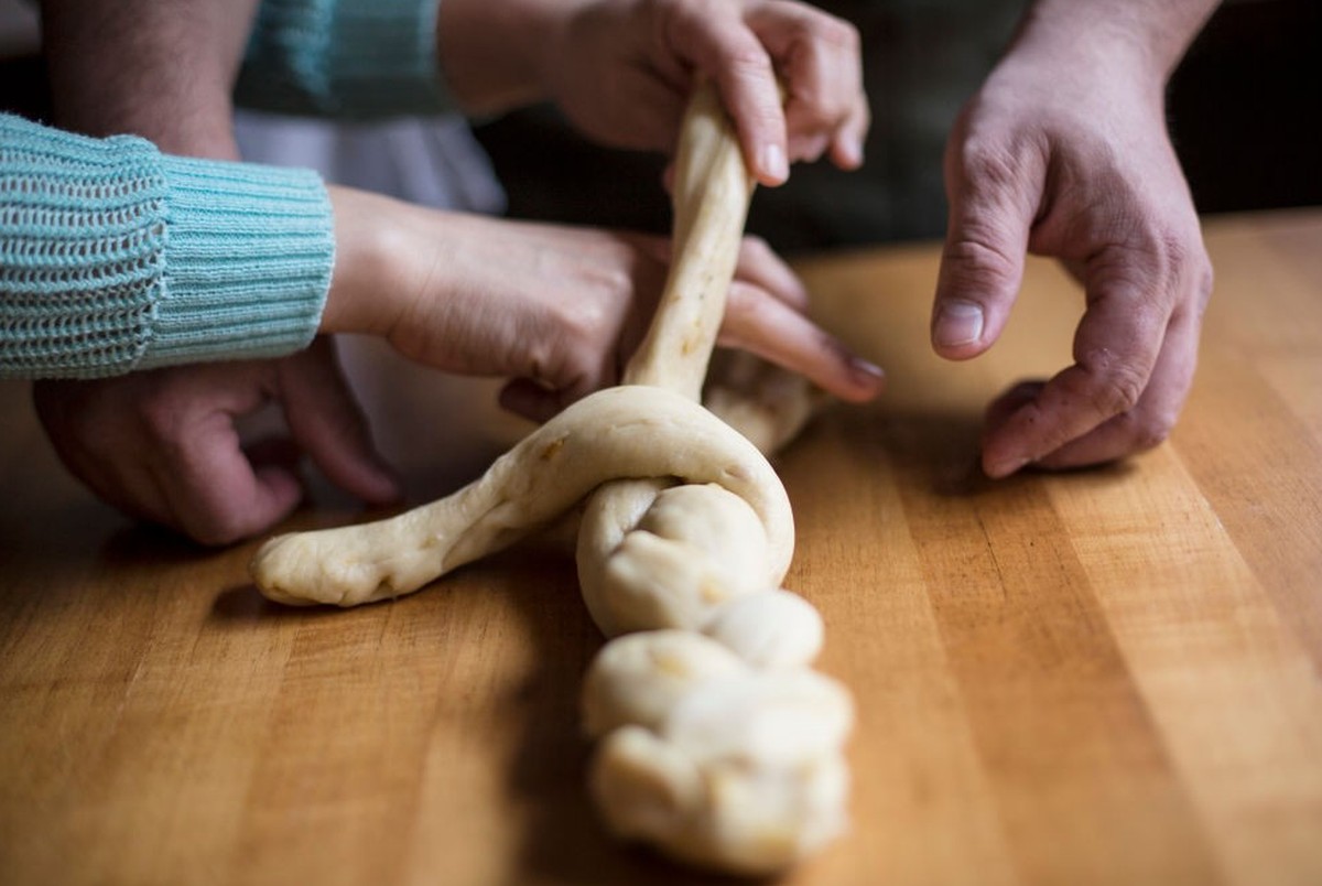PORTLAND, ME - APRIL 5: Ilma Jeil Lopez and Damian Sansonetti, owners of Piccolo restaurant, work on the braid while making Easter Bread. (Staff photo by Derek Davis/Portland Portland Press Herald via ...