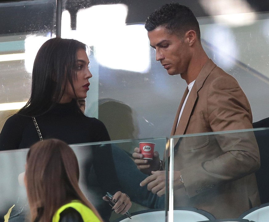 TURIN, ITALY - OCTOBER 02: Cristiano Ronaldo and Georgina Rodriguez are seen during the Group H match of the UEFA Champions League between Juventus and BSC Young Boys at Allianz Stadium on October 2,  ...