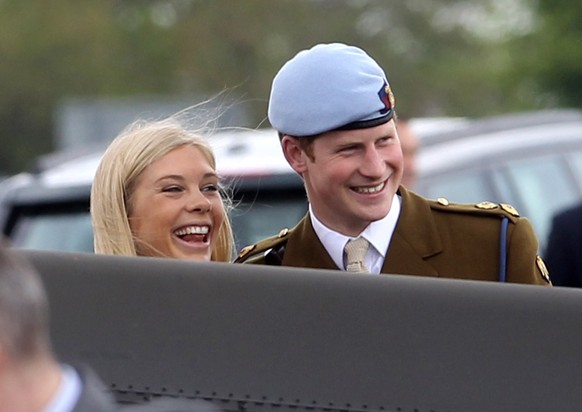 ANDOVER, ENGLAND - MAY 07: Prince Harry and Chelsy Davy laugh as they attend Prince Harry&#039;s Pilot Course Graduation at the Army Aviation Centre on May 7, 2010 in Andover, England. The Prince of W ...