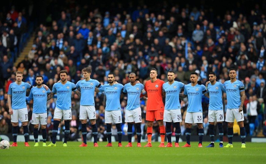 26th January 2019, Etihad Stadium, Manchester, England; FA Cup football, 4th round, Manchester City versus Burnley; the Manchester City team observe a minute s silence in memory of Cardiff City player ...