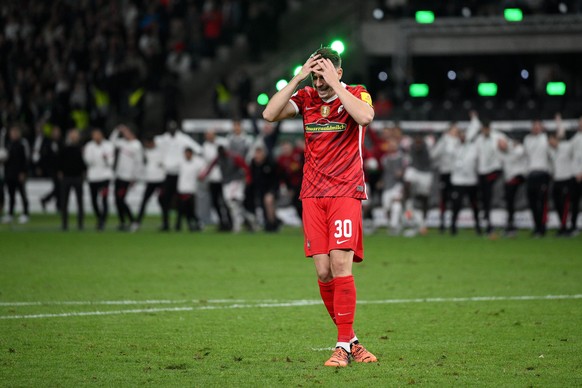 BERLIN, GERMANY - MAY 21: Christian Guenter of SC Freiburg reacts after missing their sides second penalty during the final match of the DFB Cup 2022 between SC Freiburg and RB Leipzig at Olympiastadi ...