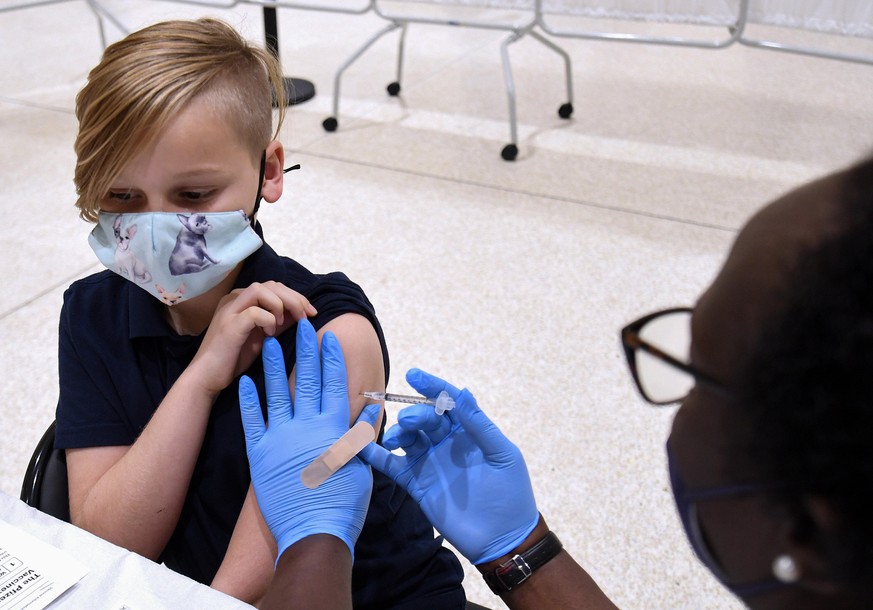 November 9, 2021, Altamonte Springs, Florida, United States: A nurse gives a boy a shot of the Pfizer COVID-19 vaccine at a vaccination site for 5-11 year-olds at Eastmonte Park in Altamonte Springs.. ...