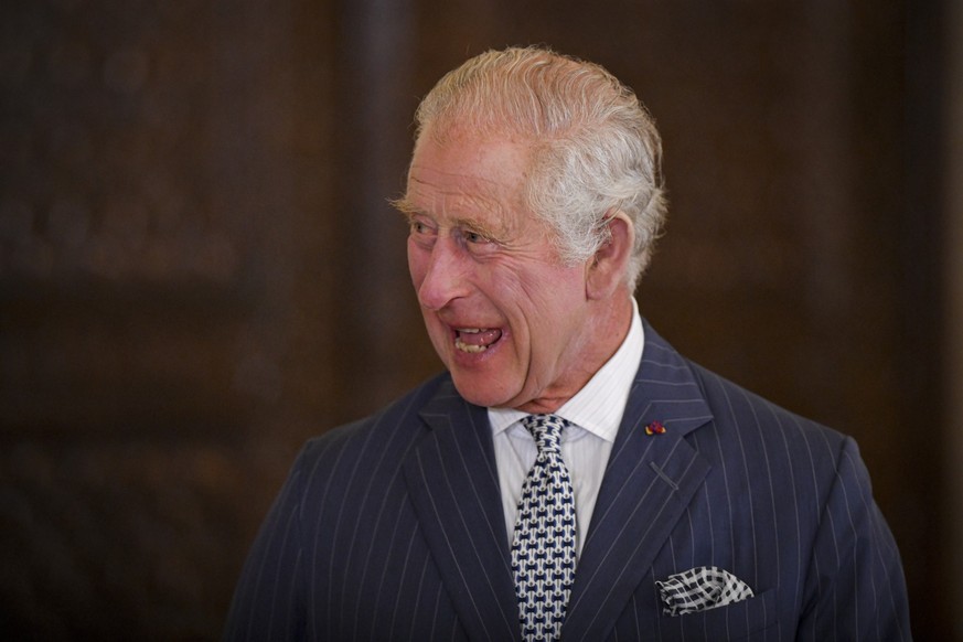 Britain&#039;s King Charles III laughs during a ceremony at the Cotroceni Presidential Palace in Bucharest, Romania, Friday, June 2, 2023. (AP Photo/Alexandru Dobre)
