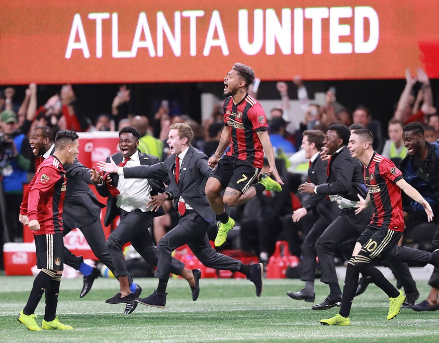 December 8, 2018 - Atlanta, GA, USA - Atlanta United s Josef Martinez leaps in the air and Miguel Almiron charges the field celebrating winning the MLS Fussball Herren USA Cup 2-0 over the Portland Ti ...