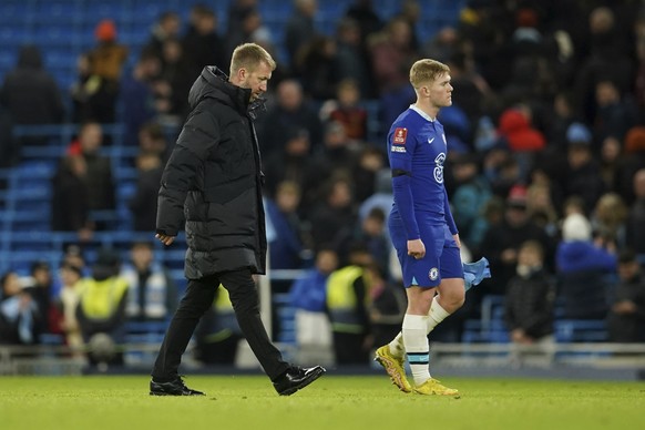 Chelsea's head coach Graham Potter, left, walks at the end of the English FA Cup soccer match between Manchester City and Chelsea at the Etihad Stadium in Manchester, England, Sunday, Jan. 8, 2023. (A ...