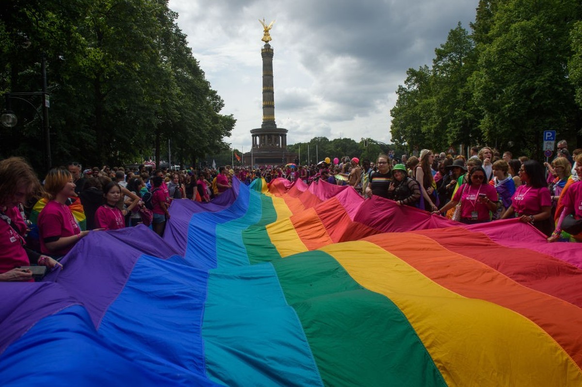 BERLIN, GERMANY - 2023/07/22: People march with huge pride flag during the pride parade. Berlin Christopher Street Day (CSD Berlin) or Berlin Pride Parade is an annual demonstration in Berlin for the ...