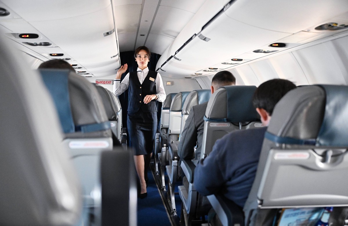Abkhazia Russia Air Traffic 8853856 07.02.2025 A stewardess is seen inside the UVT Aero CRJ 200 plane, which made a test flight from Moscow to Sukhum, at the airport of Sukhum, Abkhazia. Russia is res ...