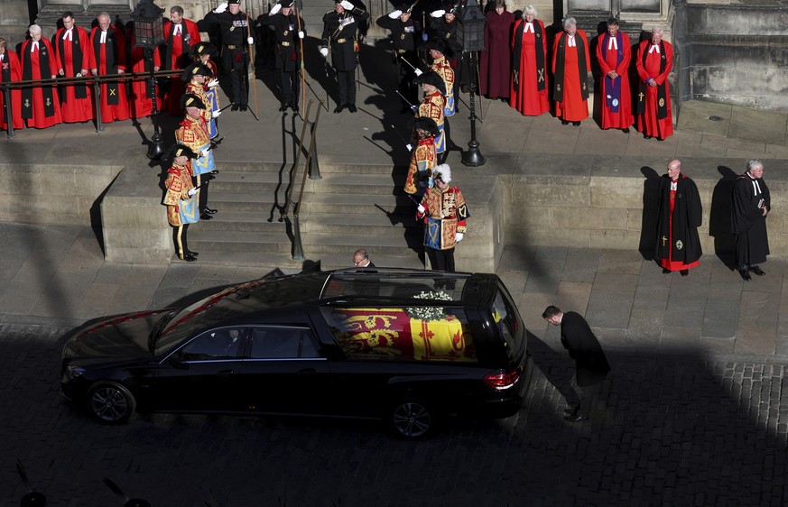 The coffin of Queen Elizabeth II is placed in the hearse from St. Giles’ Cathedral in Edinburgh, Scotland, Tuesday Sept. 13, 2022. The coffin of Queen Elizabeth II has been carried out of St. Giles’ C ...