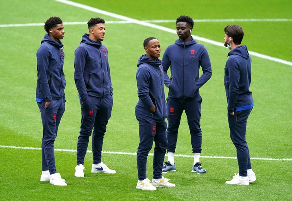 England v Germany - UEFA Euro 2020 - Round of 16 - Wembley Stadium. England&#039;s Marcus Rashford (left), Jandon Sancho, Raheem Sterling, and Bukayo Saka inspect the pitch before the UEFA Euro 2020 r ...