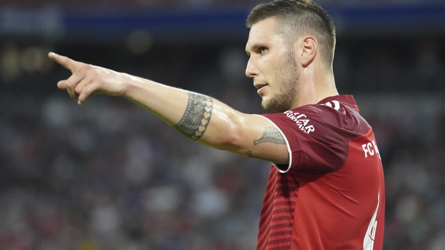 File - Bayern&#039;s Niklas Suele gestures during the German Bundesliga soccer match between Bayern and Eintracht Frankfurt, in Munich, Germany, Sunday, Oct. 3, 2021. Germany defender Niklas Suele is  ...