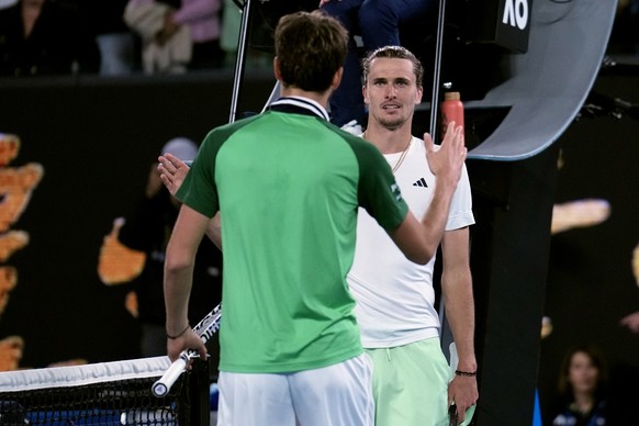 Alexander Zverev, right, of Germany congratulates Daniil Medvedev of Russia following their semifinal at the Australian Open tennis championships at Melbourne Park, Melbourne, Australia, early Saturda ...