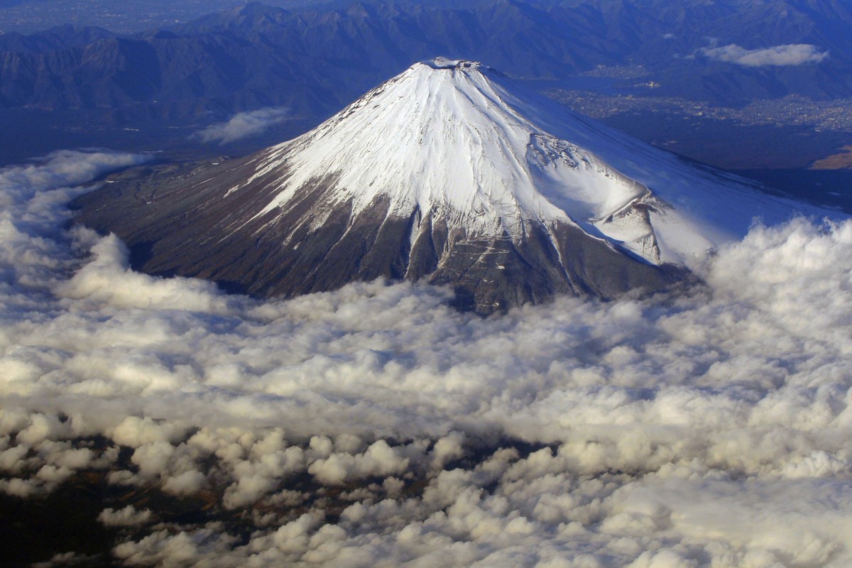 FILE - In this Dec. 8, 2010 file photo, snow-covered Mount Fuji, Japan&#039;s highest peak at 3,776-meters tall (12,385 feet), is seen from an airplane window. Those who want to climb one of the most  ...