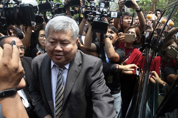 Thai billionaire construction tycoon Premchai Karnasuta leaves The Thong Pha Phum Provincial Court in Kanchanaburi, Thailand Tuesday, March 19, 2019. The court sentenced Premchai to 16 months in priso ...