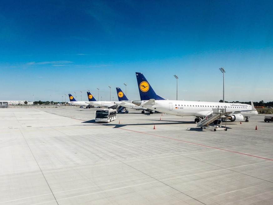 Munich, Germany - August 17, 2014: A series of Lufthansa airbus A321-300 airplane parked on the track of Munich international hub airport before take off. Munich is a Lufthansa hub and Lufthansa is on ...