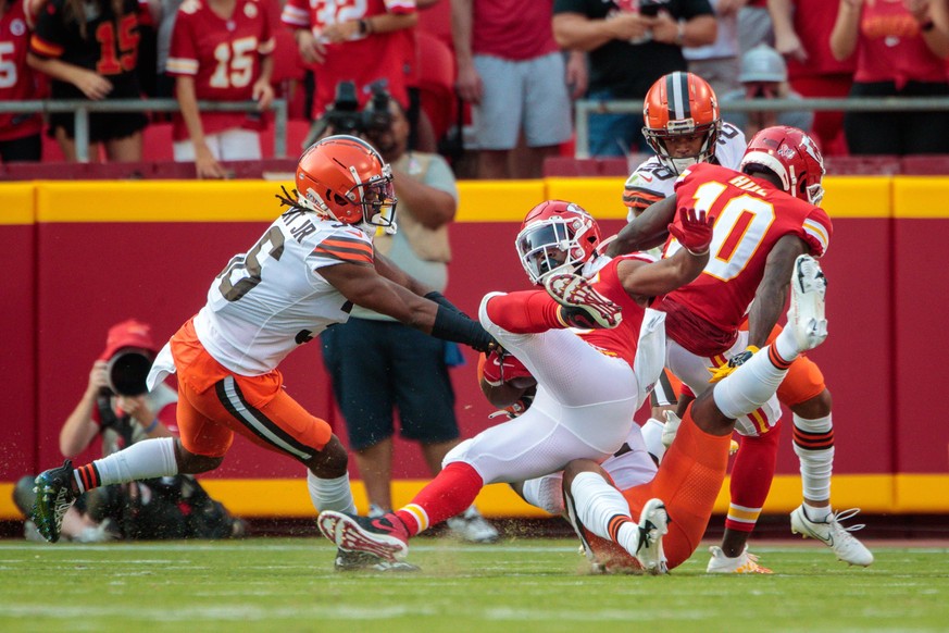 KANSAS CITY, MO - SEPTEMBER 12: Kansas City Chiefs running back Clyde Edwards-Helaire 25 gets upended during a play against the Cleveland Browns on September 12th at GEHA field at Arrowhead Stadium in ...