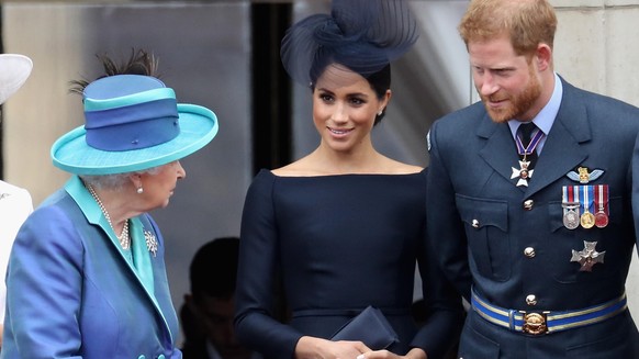 LONDON, ENGLAND - JULY 10: (L-R) Queen Elizabeth II, Meghan, Duchess of Sussex, Prince Harry, Duke of Sussex watch the RAF flypast on the balcony of Buckingham Palace, as members of the Royal Family a ...