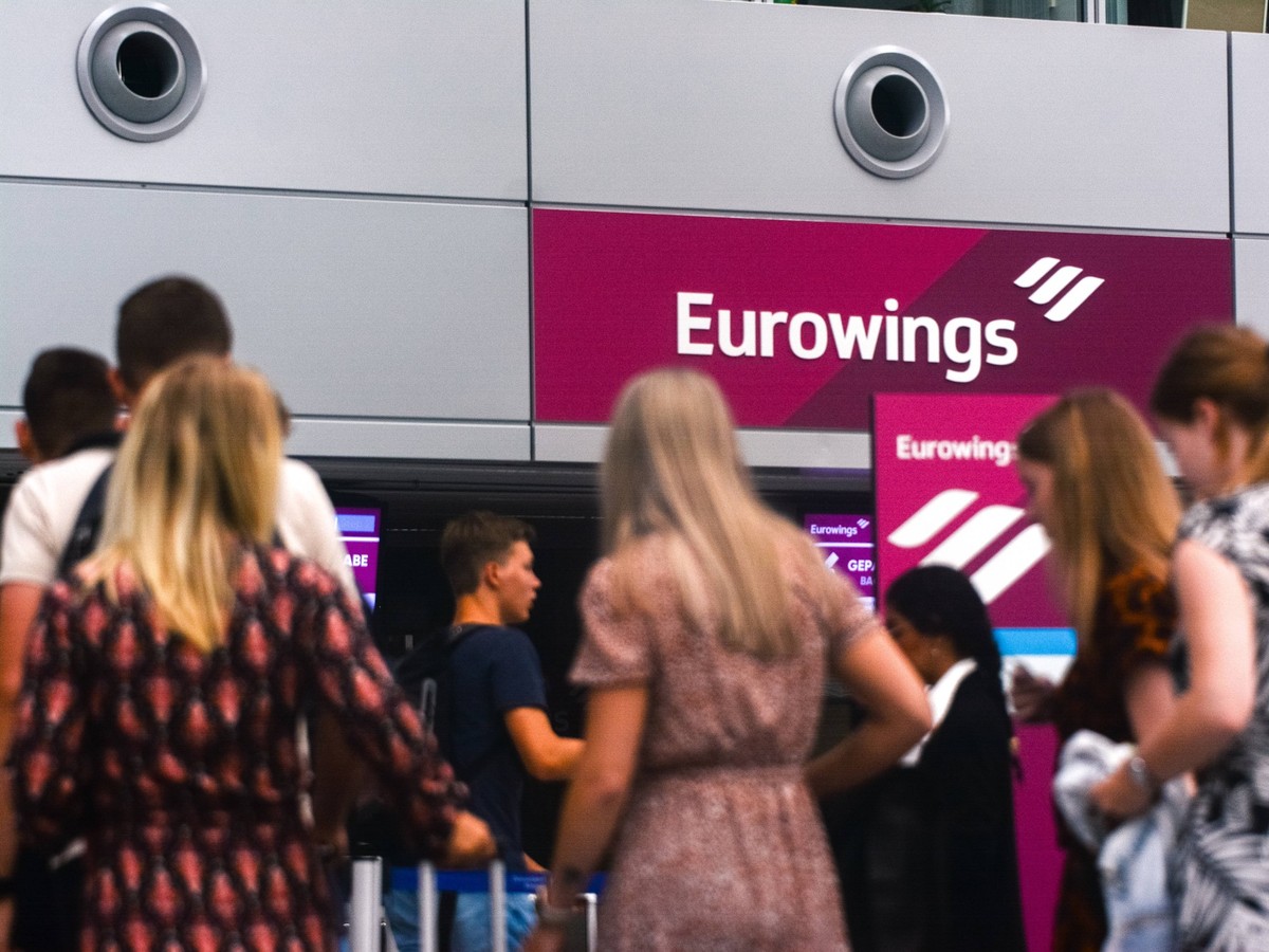 Duesseldorf Airport At The Begin Of Summer Holiday Season general view of travellers are seen waiting in front of Eurowings check in counter area as the summer holiday season starts at Duesseldorf air ...