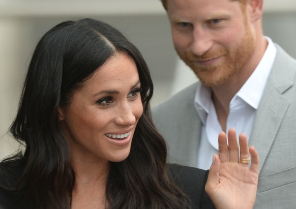 Britain&#039;s Prince Harry and Meghan, the Duchess of Sussex, waves at well-wishers during a walkabout in Dublin, Ireland, July 11, 2018. REUTERS/Clodagh Kilcoyne