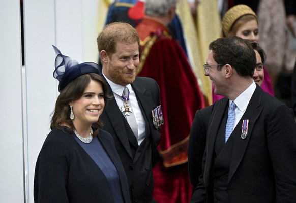 Britain&#039;s Prince Harry, Duke of Sussex, Princess Eugenie and her husband Jack Brooksbank leave Westminster Abbey following the coronation ceremony of Britain&#039;s King Charles and Queen Camilla ...
