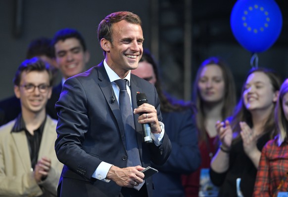 French president Emmanuel Macron smiles in front of participants of the Charlemagne Youth Prize on the podium of a European Feast in Aachen, Germany, Wednesday, May 9, 2018. Macron will receive the pr ...