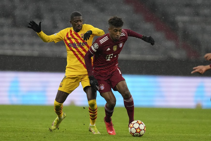 Barcelona&#039;s Ousmane Dembele, left, tries to stop Bayern&#039;s Kingsley Coman during the Champions League group E soccer match between Bayern Munich and FC Barcelona in Munich, Germany, Wednesday ...