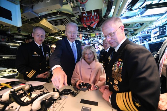 RECORD DATE NOT STATED 220402-N-GR655-1000 WILMINGTON, Delaware April 2, 2022 President of the United States Joe Biden and First Lady Jill Biden operate the periscope using a video game controller alo ...