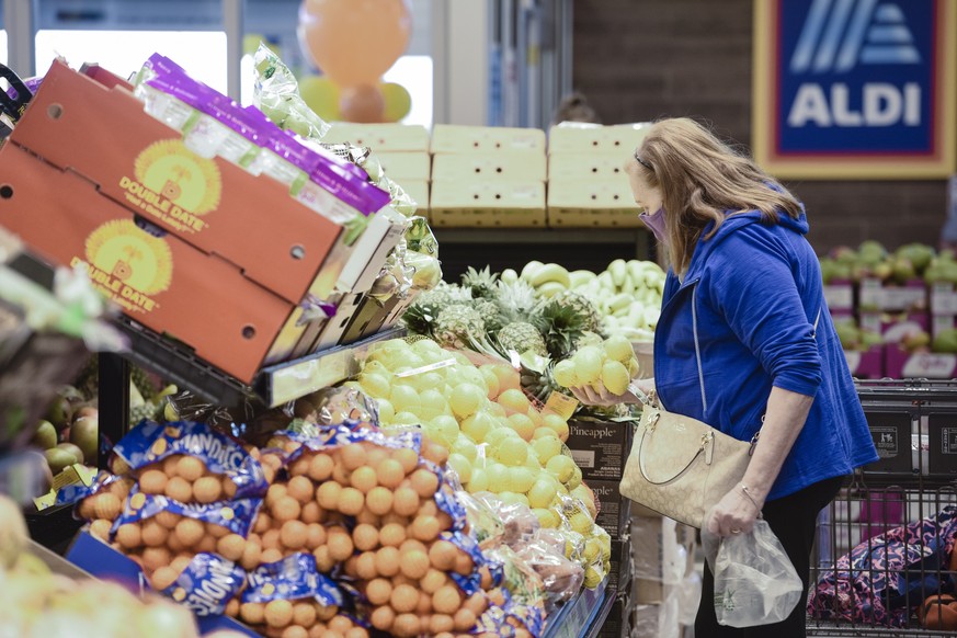 IMAGE DISTRIBUTED FOR ALDI - Customer shops the fresh produce section at the new Goodyear, AZ ALDI store on Thursday, Nov. 5, 2020. The store will be open daily from 9 a.m. to 9 p.m. (Mark Peterman/AP ...