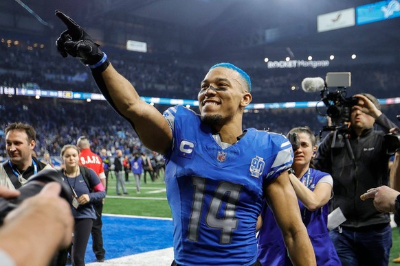 Syndication: Detroit Free Press Detroit Lions wide receiver Amon-Ra St. Brown celebrates the 31-23 win over the Tampa Bay Buccaneers in the NFC divisional round at Ford Field in Detroit on Sunday, Jan ...