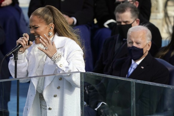 Jennifer Lopez performs as President-elect Joe Biden watches during the 59th Presidential Inauguration at the U.S. Capitol in Washington, Wednesday, Jan. 20, 2021. (AP Photo/Andrew Harnik)