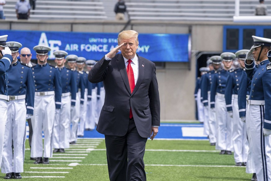 May 30, 2019 - Colorado Springs, CO, United States of America - U.S President Donald Trump salutes as he walks past the honor guard on arrival for the the U.S. Air Force Academy Graduation Ceremony at ...