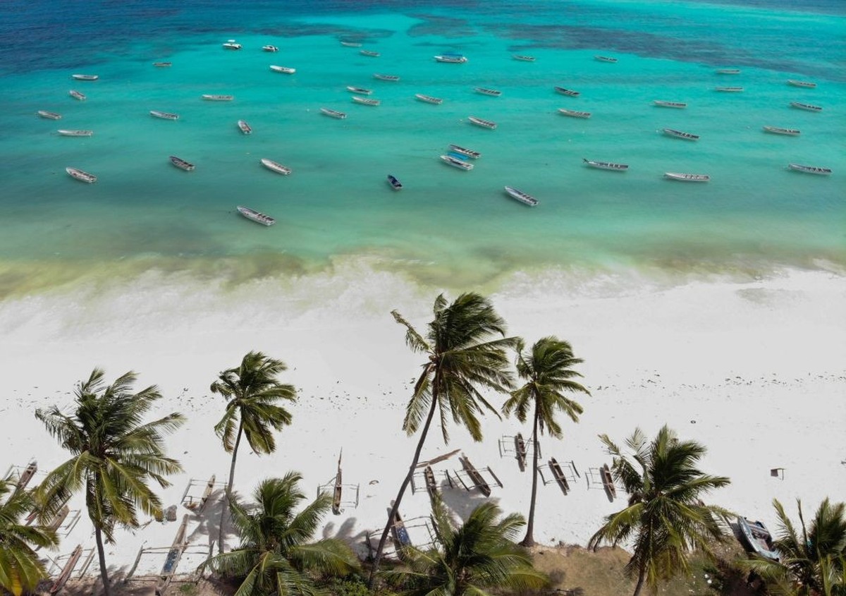 ZANZIBAR, TANZANIA - AUGUST 23 : Drone photo shows small wooden fishing boats on the white sandy shore in the Indian Ocean in Zanzibar, Tanzania on August 23, 2018. (Photo by Mahmut Serdar Alakus/Anad ...