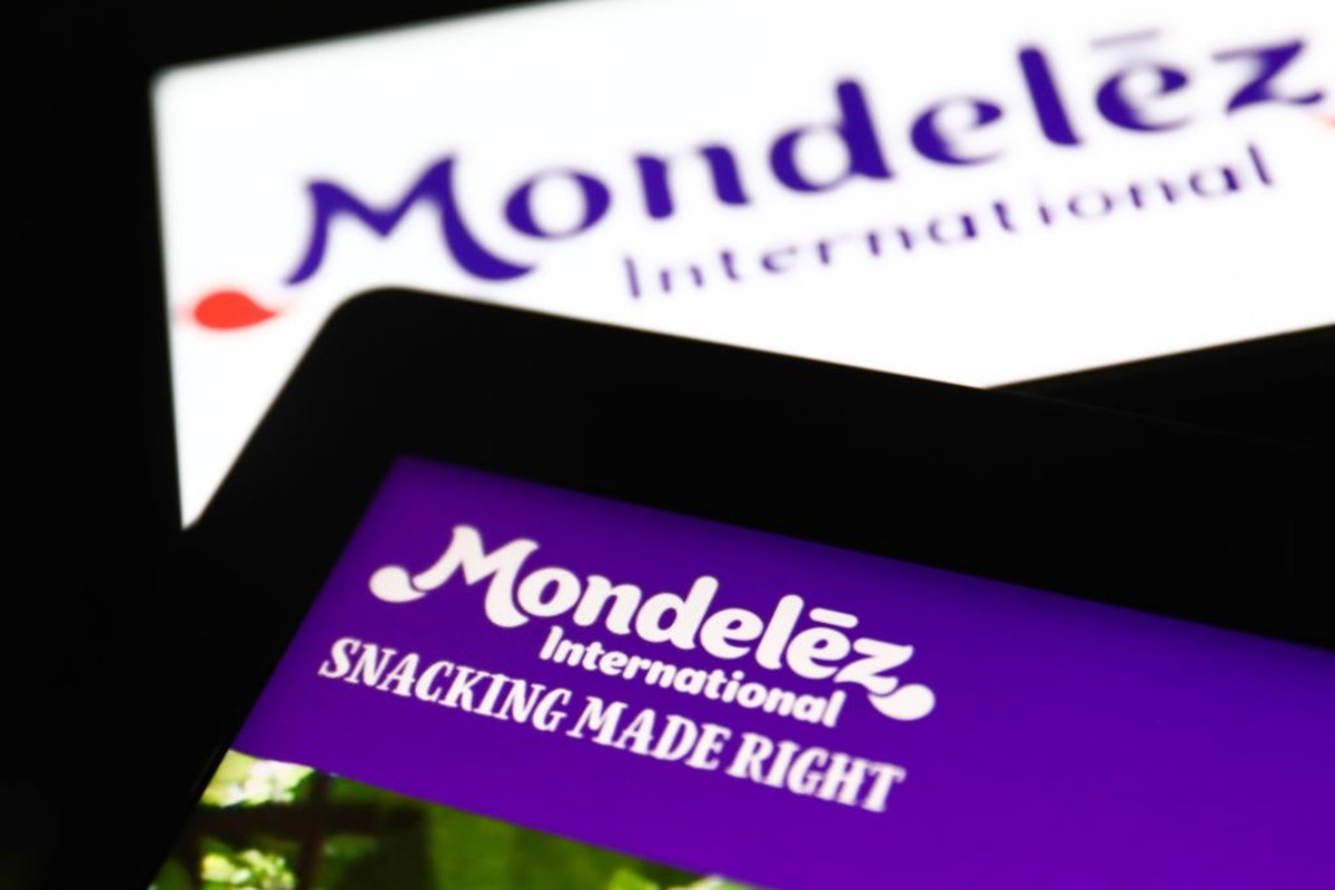 Mondelez International logos displayed on a laptop and a phone screens are seen in this illustration photo taken in Krakow, Poland on September 25, 2021. (Photo by Jakub Porzycki/NurPhoto via Getty Im ...