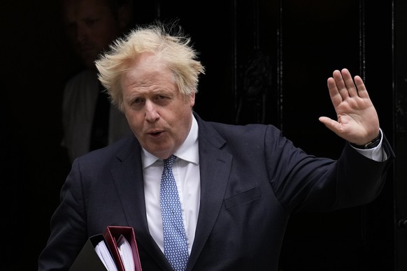 FILE - British Prime Minister Boris Johnson leaves 10 Downing Street to attend the weekly Prime Minister&#039;s Questions at the Houses of Parliament, in London, May 25, 2022. Former British Prime Min ...