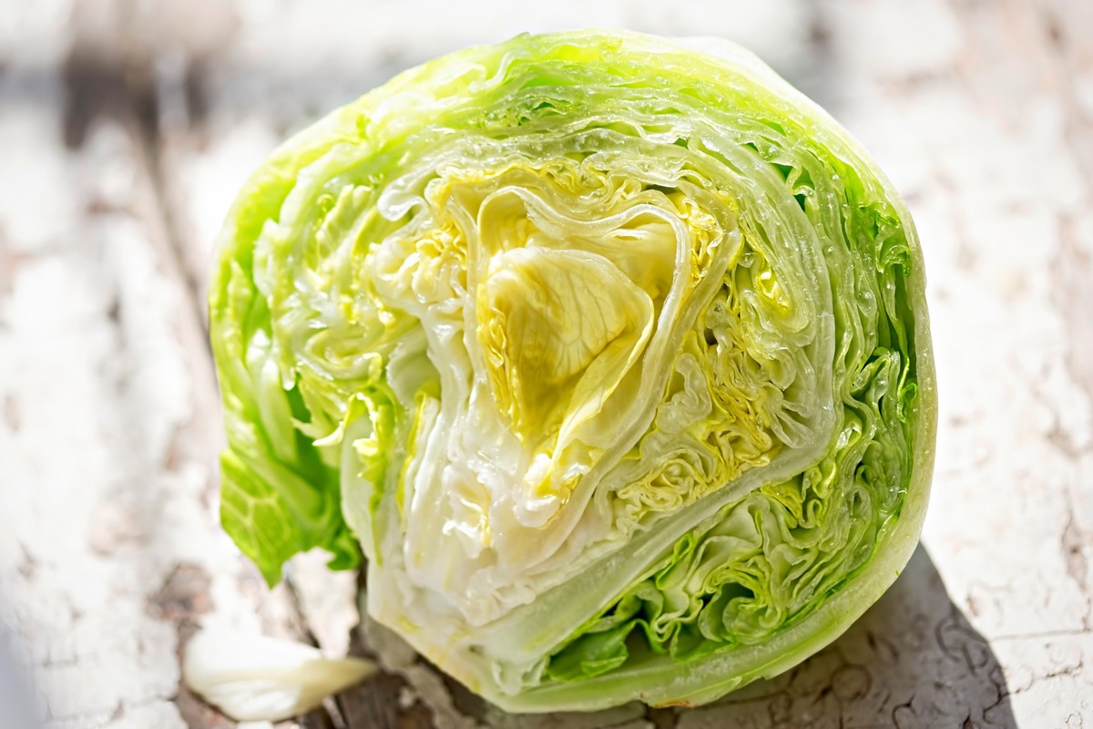 Iceberg lettuce half on table