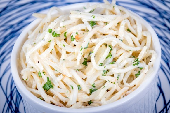 Celery Root Remoulade salad julienned celeriac with a Dijon mustard dressing on a rustic table