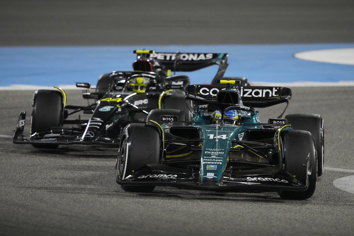 Mercedes driver Lewis Hamilton of Britain and Aston Martin driver Fernando Alonso of Spain, front in action during the Formula One Bahrain Grand Prix at Sakhir circuit, Sunday, March 5, 2023. (AP Phot ...