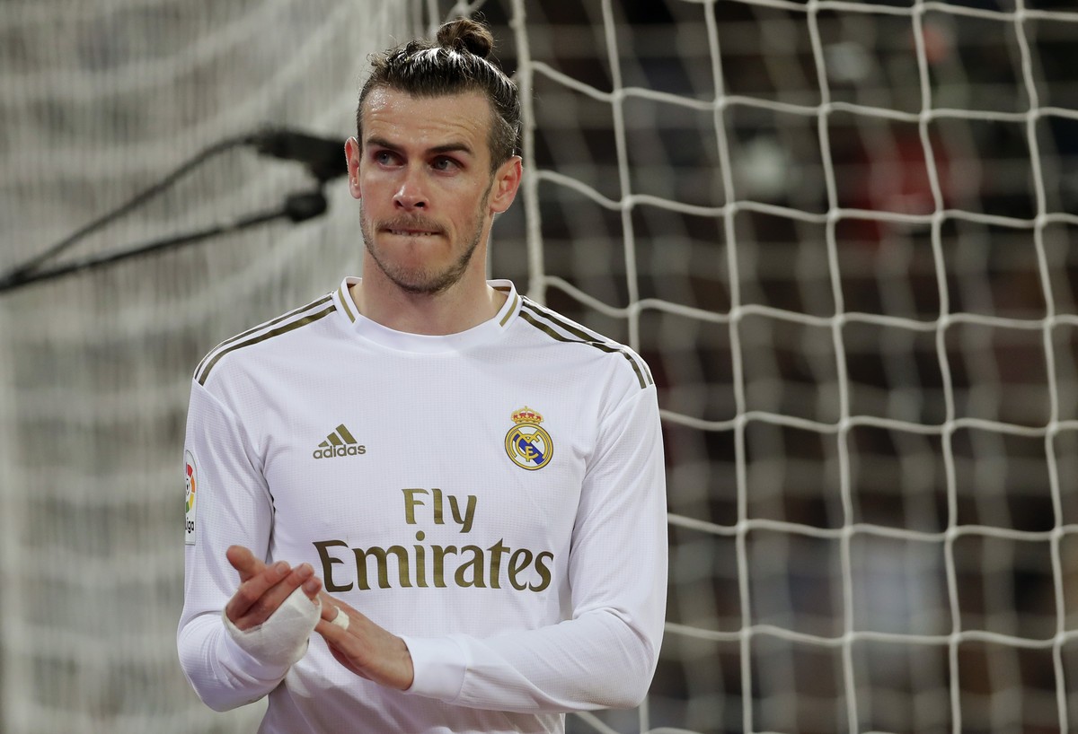Real Madrid's Gareth Bale leaves the game during the Spanish La Liga soccer match between Real Madrid and Celta de Vigo at the Santiago Bernabeu stadium in Madrid, Spain, Sunday, Feb. 16, 2020. ( ...