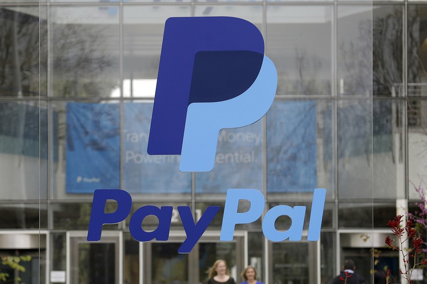 FILE - Signage outside PayPal headquarters in San Jose, Calif., is pictured on March 10, 2015. PayPal said Tuesday, Jan. 31, 2023, that it will trim about 7% of its total workforce, or about 2,000 ful ...