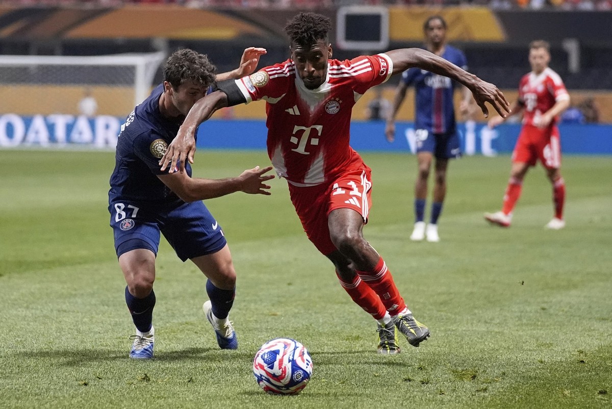 Bayern Munich&#039;s Kingsley Coman tries to get past Paris Saint-Germain&#039;s Joao Neves during the Club World Cup quarterfinal soccer match between PSG and Bayern Munich in Atlanta, Saturday, July ...