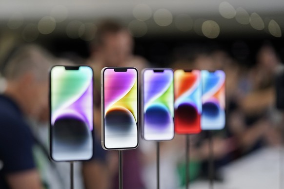 FILE- New iPhone 14 models on display at an Apple event on the campus of Apple's headquarters in Cupertino, Calif., Sept. 7, 2022. Apple Inc. will manufacture its latest iPhone 14 in India, the compan ...