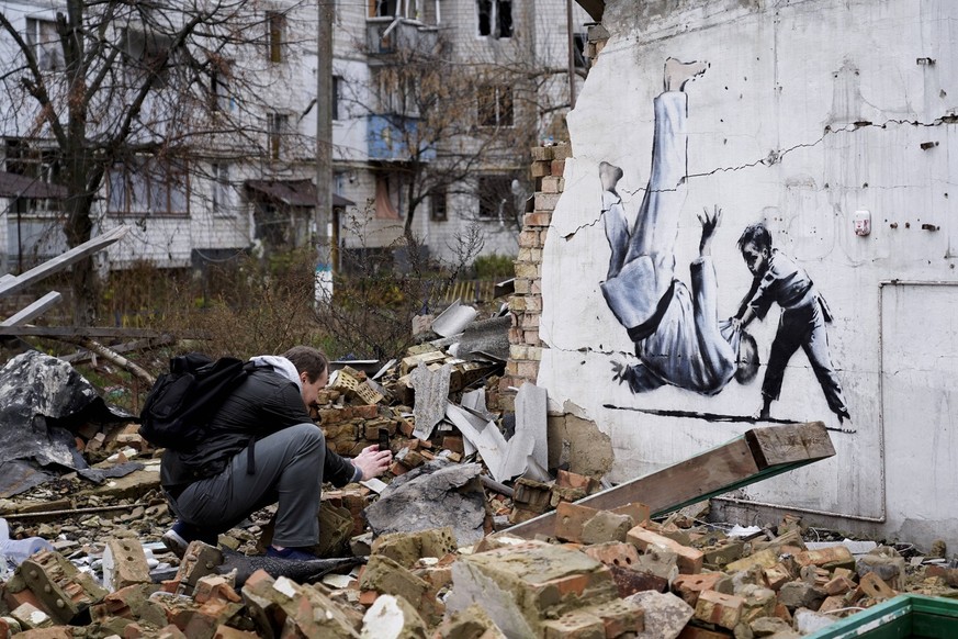 Banksy Graffiti Appeared On Several Destroyed Buildings In The Kyiv Region Graffiti in the city of Borodyanka, Ukraine, on November 12, 2022. In the cities of the Kyiv region affected by the Russian a ...