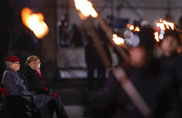German Chancellor Angela Merkel follows proceedings at the Defence Ministry during the Grand Tattoo (Grosser Zapfenstreich), a ceremonial send-off for her, in Berlin on Thursday, Dec. 2, 2021. (Odd An ...