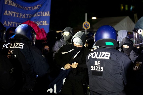Police officers scuffle with demonstrators during the protest &quot;Take Back The Night - queer feminists fight back&quot; during so-called Walpurgis Night ahead of May Day in Berlin, Germany, April 3 ...