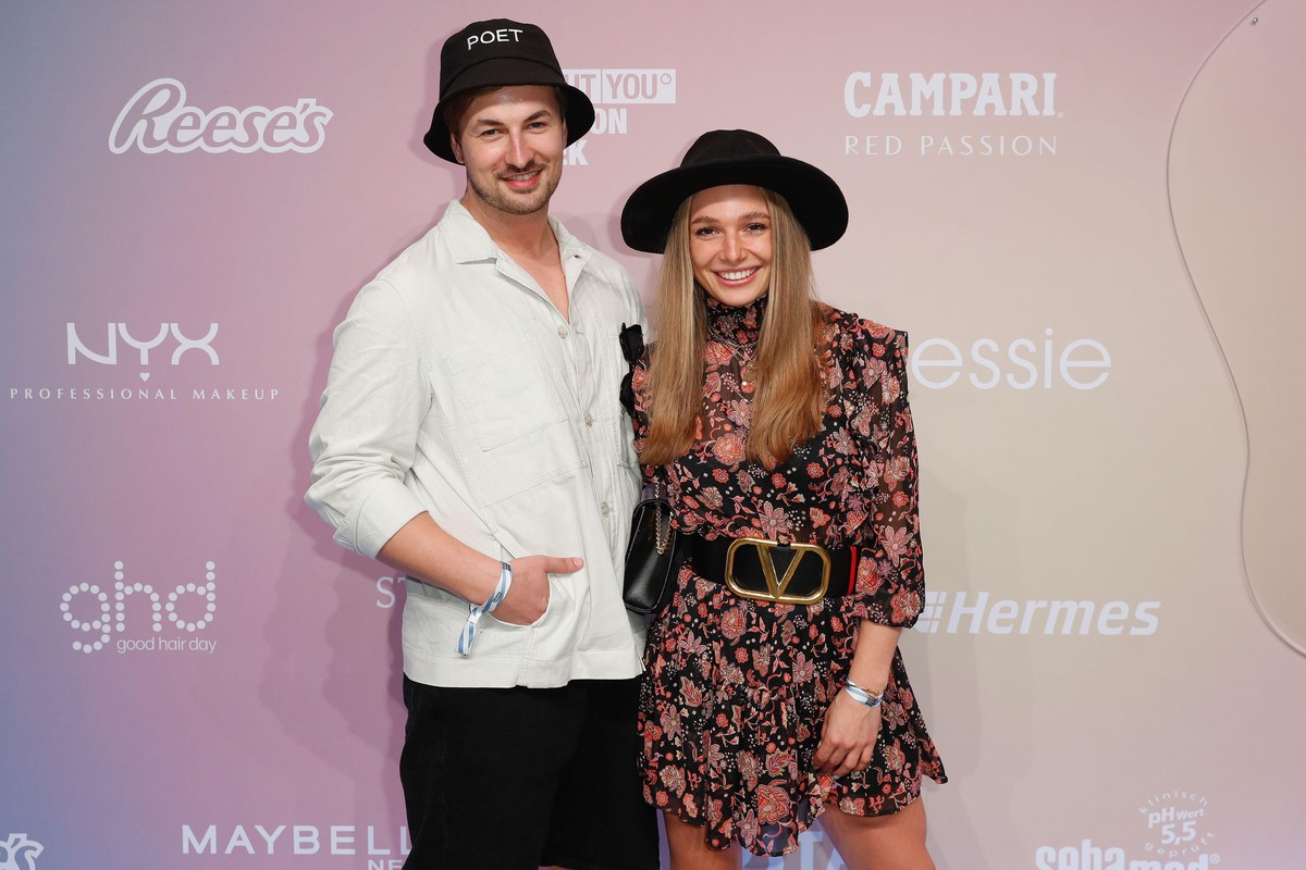 BERLIN, GERMANY - SEPTEMBER 15: Nicolas Puschmann and Lola Weippert attend the Tom Tailor show during the ABOUT YOU Fashion Week Autumn/Winter 21 at Kraftwerk on September 15, 2021 in Berlin, Germany. ...