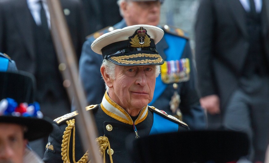 September 19, 2022, London, England, United Kingdom: King CHARLES III is seen following the coffin of Queen Elizabeth II, dripped with royal standard on Horse Guards Road during the funeral procession ...
