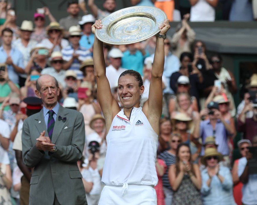 Germany s Angelique Kerber holds the Trophy after victory against American Serena Williams in the Women s Final of the 2018 Wimbledon championships, London on July 14, 2018. Kerber defeated Williams 6 ...