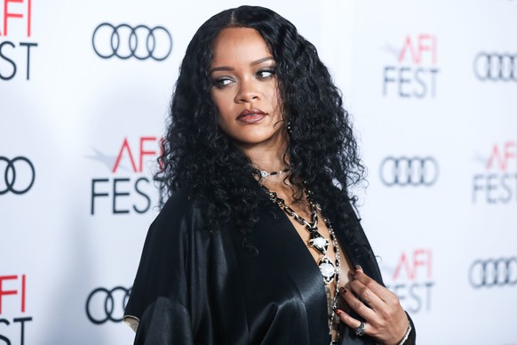 Singer Rihanna wearing a John Galliano evening coat from William Vintage along with a necklace and bracelets by David Webb arrives at the AFI FEST 2019 - Opening Night Gala - Premiere Of Universal Pic ...