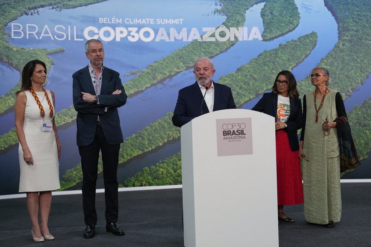 Brazil President Luiz Inacio Lula da Silva, center, speaks as Ana Toni, COP30 CEO, from left, André Corrêa do Lago, COP30 president, Rosangela da Silva and Marina Silva, Brazil environment minister, l ...
